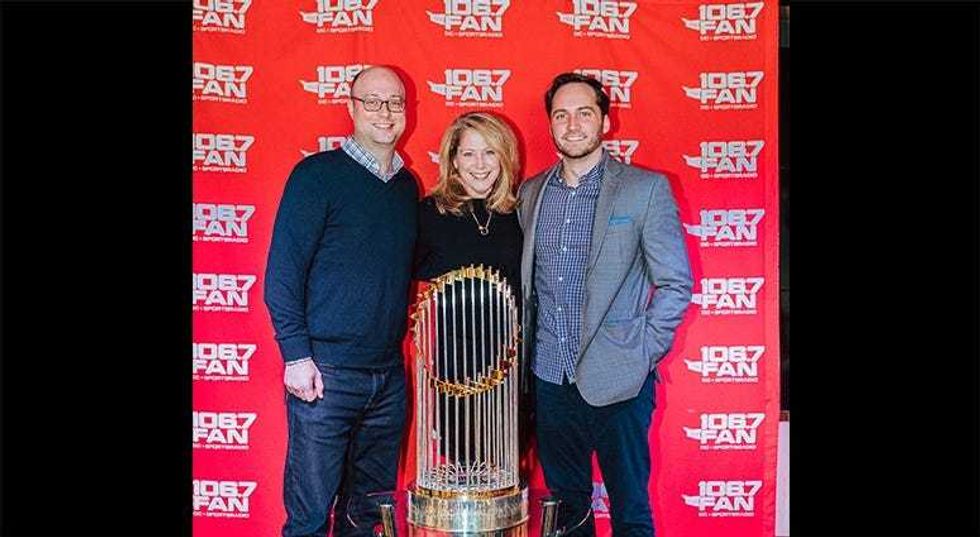 106.7 The Fan station management poses with The Commissioner's Trophy