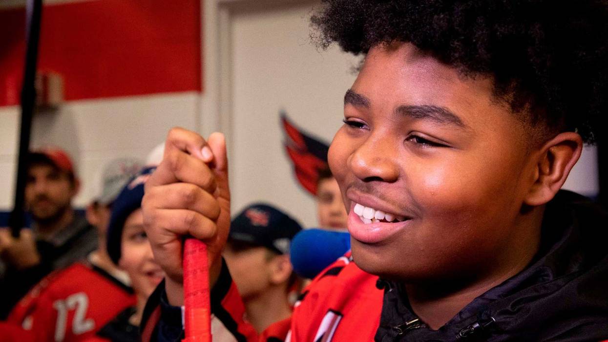 13-year-old Divyne Apollon II of the Metro Maple Leafs meets Devante Smith-Pelly and the Washington Capitals