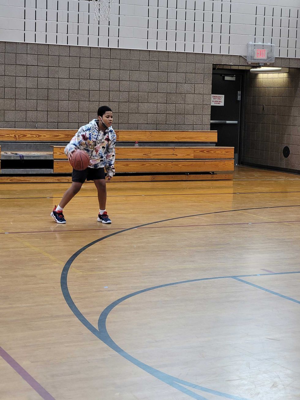 13-year-old Gentric practicing basketball at Whitter Recreation Center