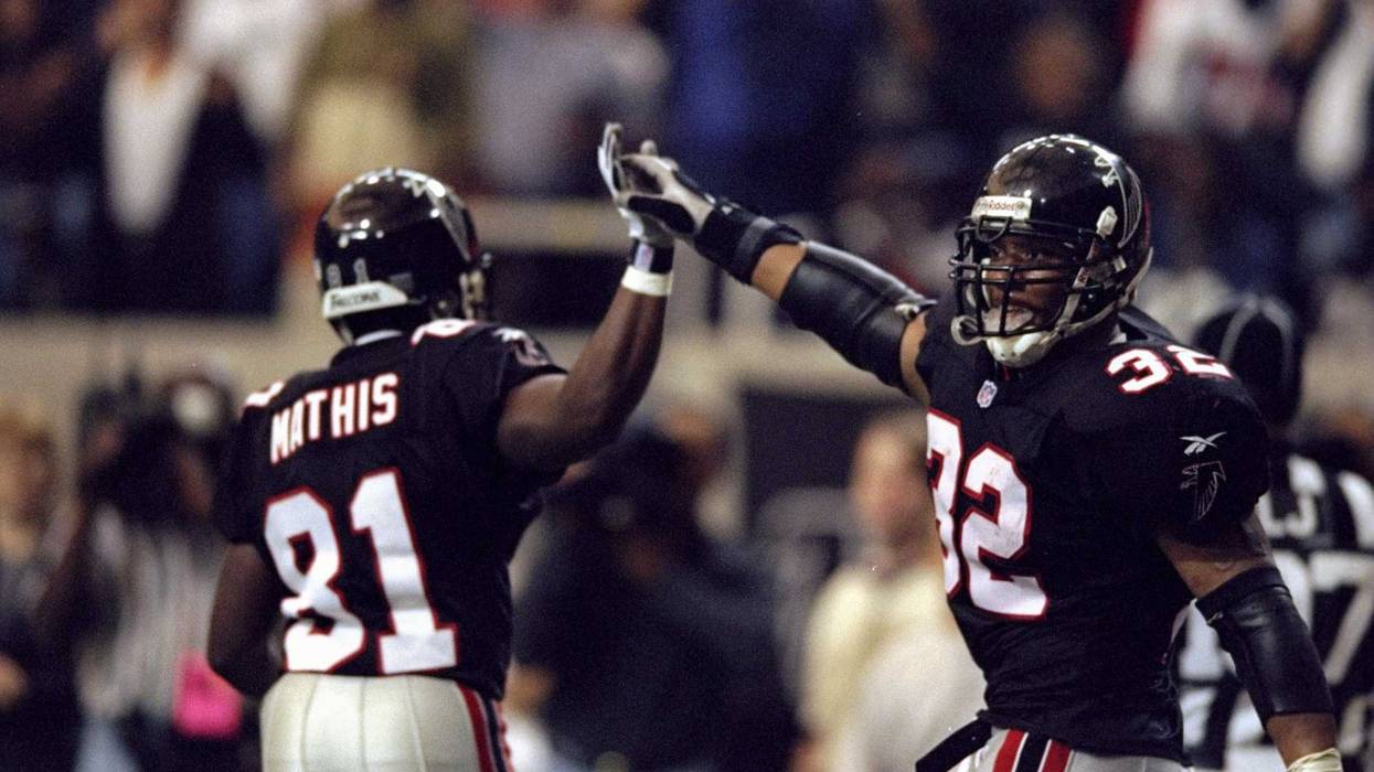 15 Nov 1998: Running back Jamal Anderson #32 and wide receiver Terance Mathis #81 of the Atlanta Falcons celebrate during the game against the San Francisco 49ers at the Georgia Dome in Atlanta, Georgia. The Falcons defeated the 49ers 31-19.