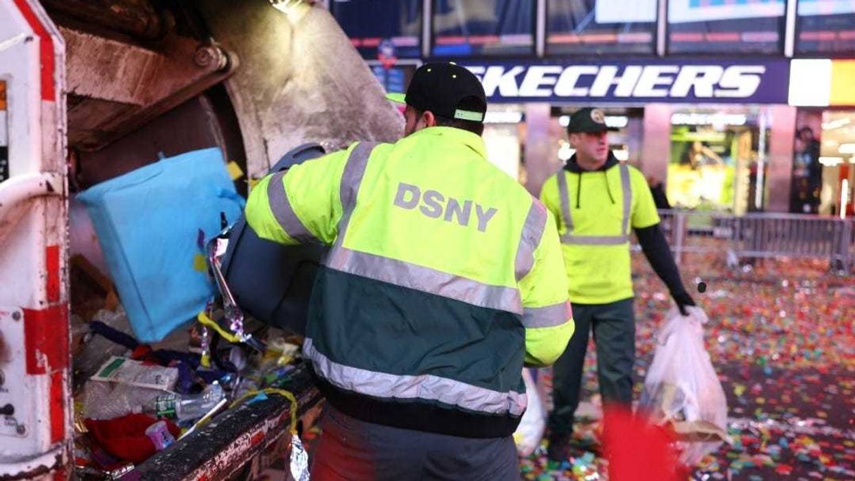 187 Department of Sanitation workers cleaned up 100,000 pounds of debris leftover from the Times Square New Year's Eve celebration.