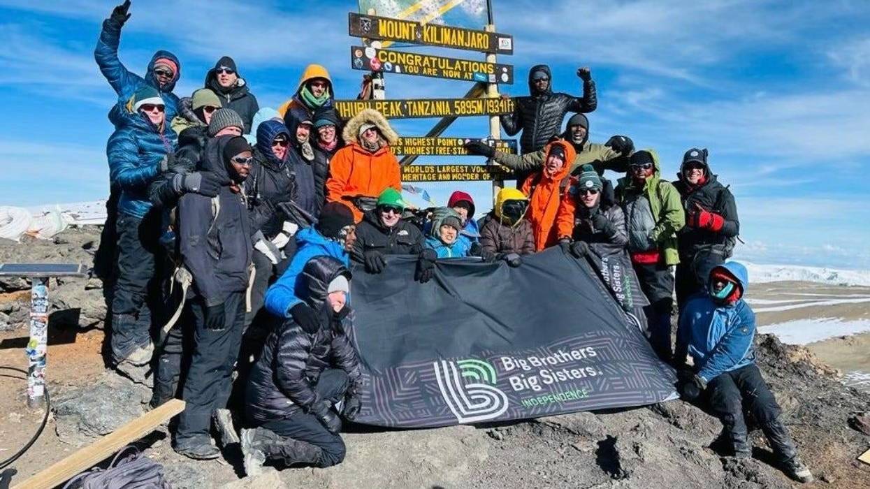 19 mentors from Big Brothers Big Sisters Independence celebrating at the top of Mount Kilimanjaro in Tanzania.