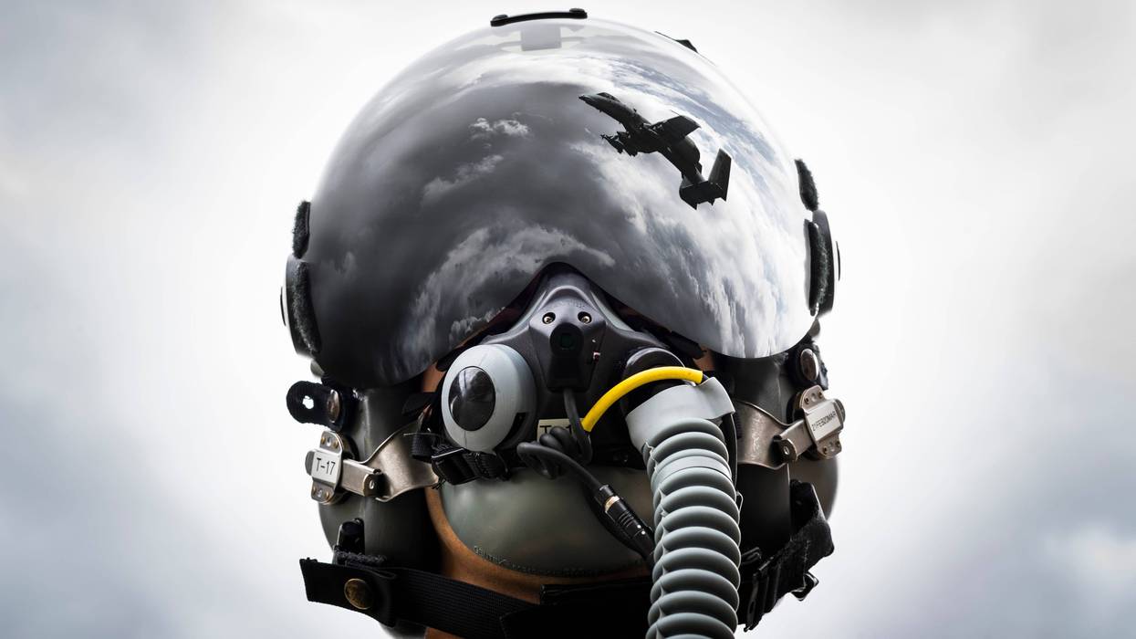 1st Lt. Anton King, 75th Fighter Squadron pilot, poses for a photo wearing an HGU-55/P helmet