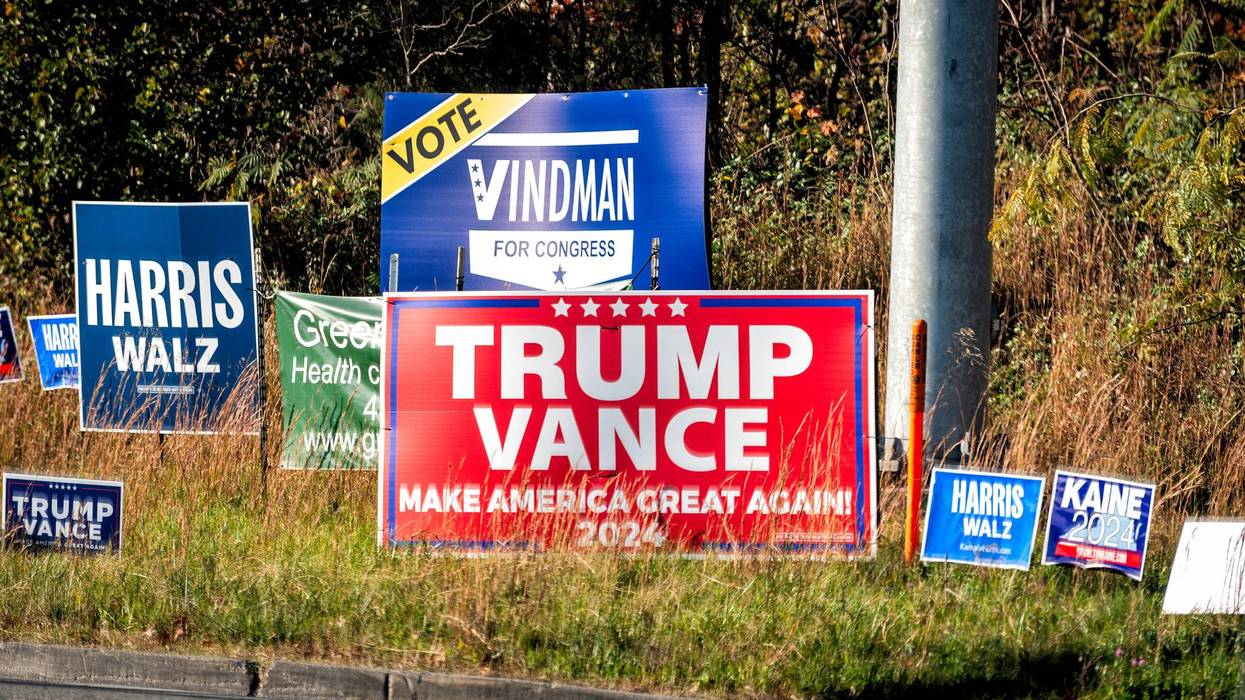 2024 US presidential campaign political signs placards on street road for Trump vance, Harris Walz campaign