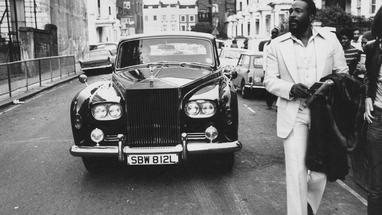 6th October 1976: American soul singer Marvin Gaye (1939 - 1984) walking ahead of his Rolls Royce in Notting Hill, London