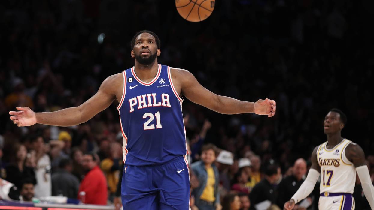 76ers center Joel Embiid, left, celebrates beating the Lakers 113-112 as Lakers point guard Dennis Schroder walks away at Crypto.Com Arena in Los Angeles Sunday, Jan. 15, 2023
