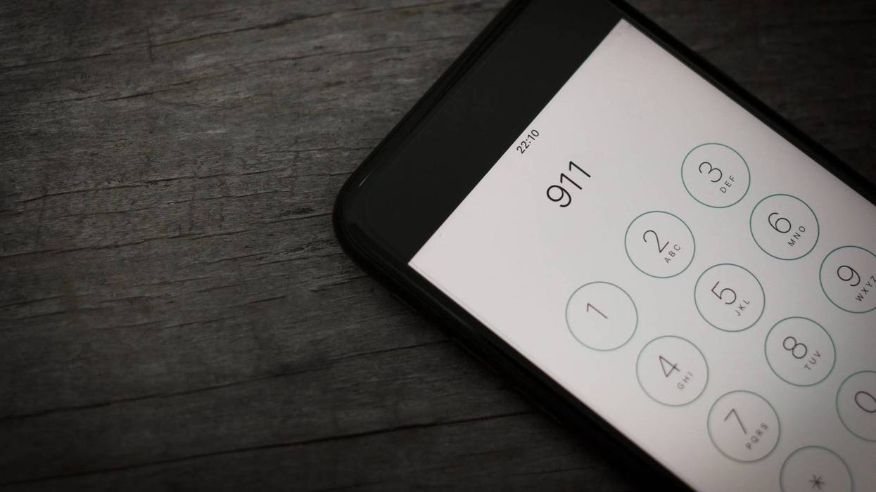 911 dialed on smartphone screen.