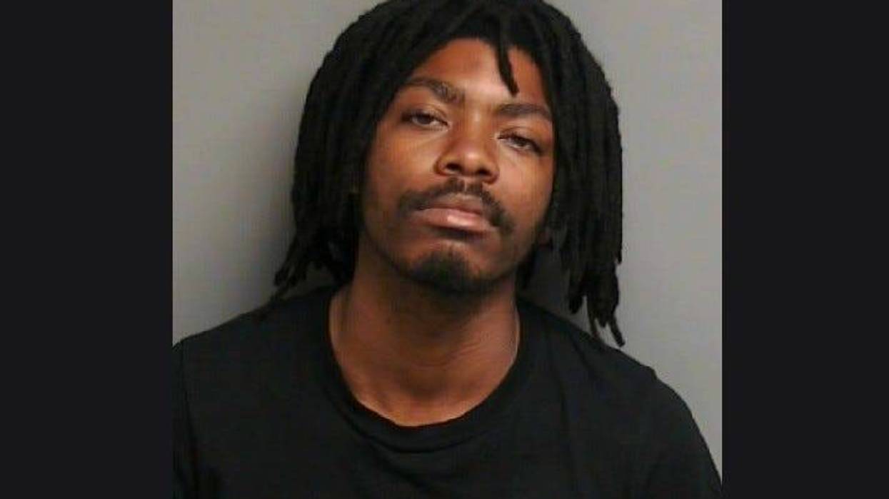 A 25-year-old has been charged with three counts of weapons and trespassing charges after he was arrested for scaling a fence and trespassing on a military base in Harrison Township.