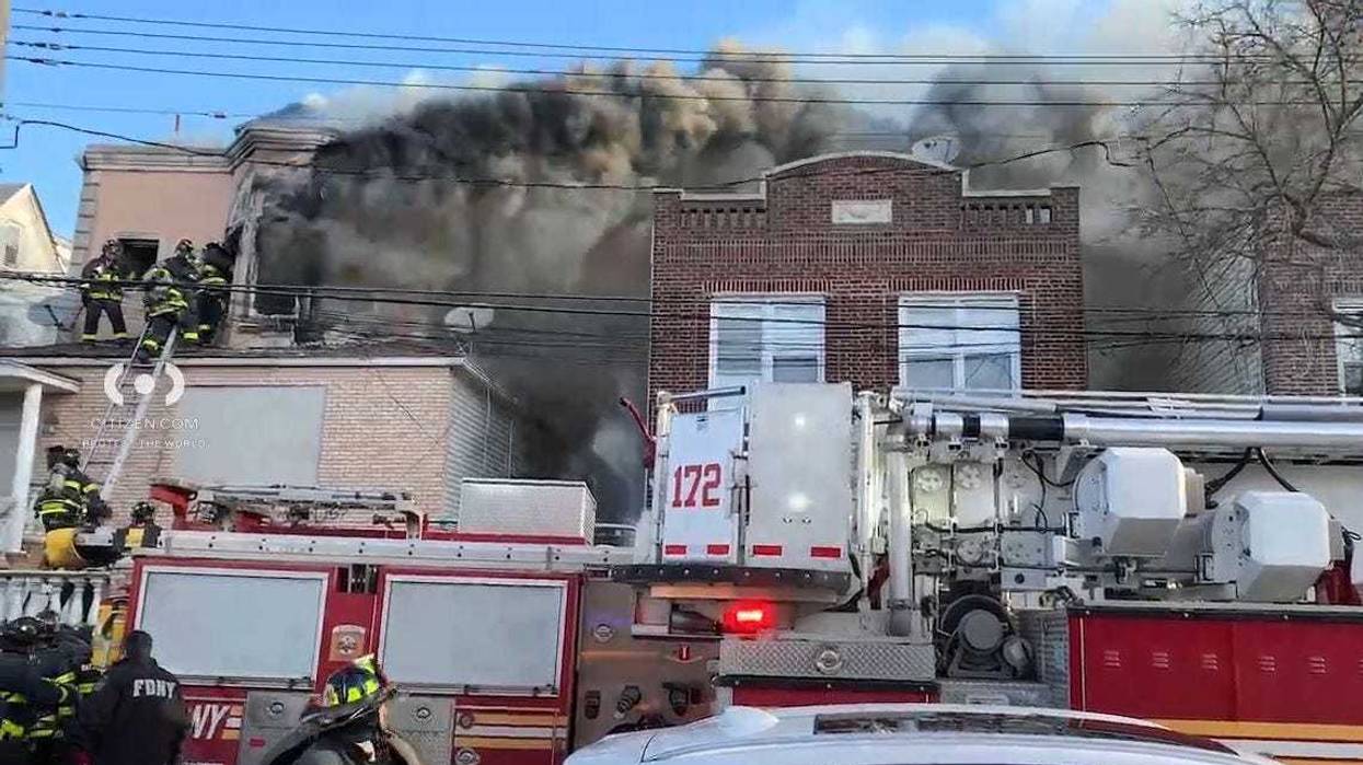 A 40-year-old woman was found dead after a fire tore through a vacant Brooklyn building she was squatting at on Tuesday morning.