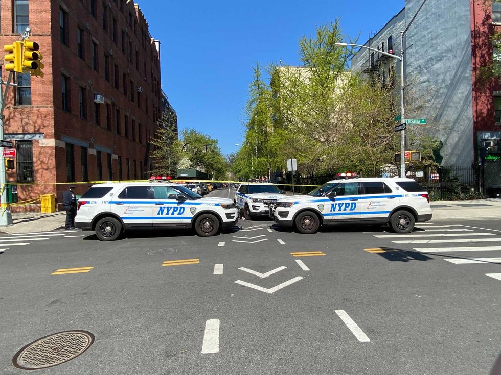 A 42-year-old man was gunned down in broad daylight in the East Village, police said as detectives investigated at the crime scene Friday morning