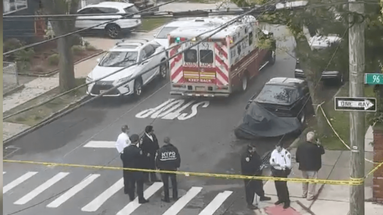 A 51-year-old woman was shot dead at a home in Queens, police said Wednesday as they search for the gunman.