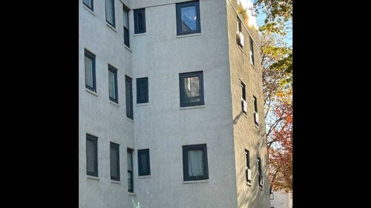 A 64-year-old woman either jumped or was pushed from her third-story Astoria apartment window after being threatened by her knife-wielding son on Friday night.