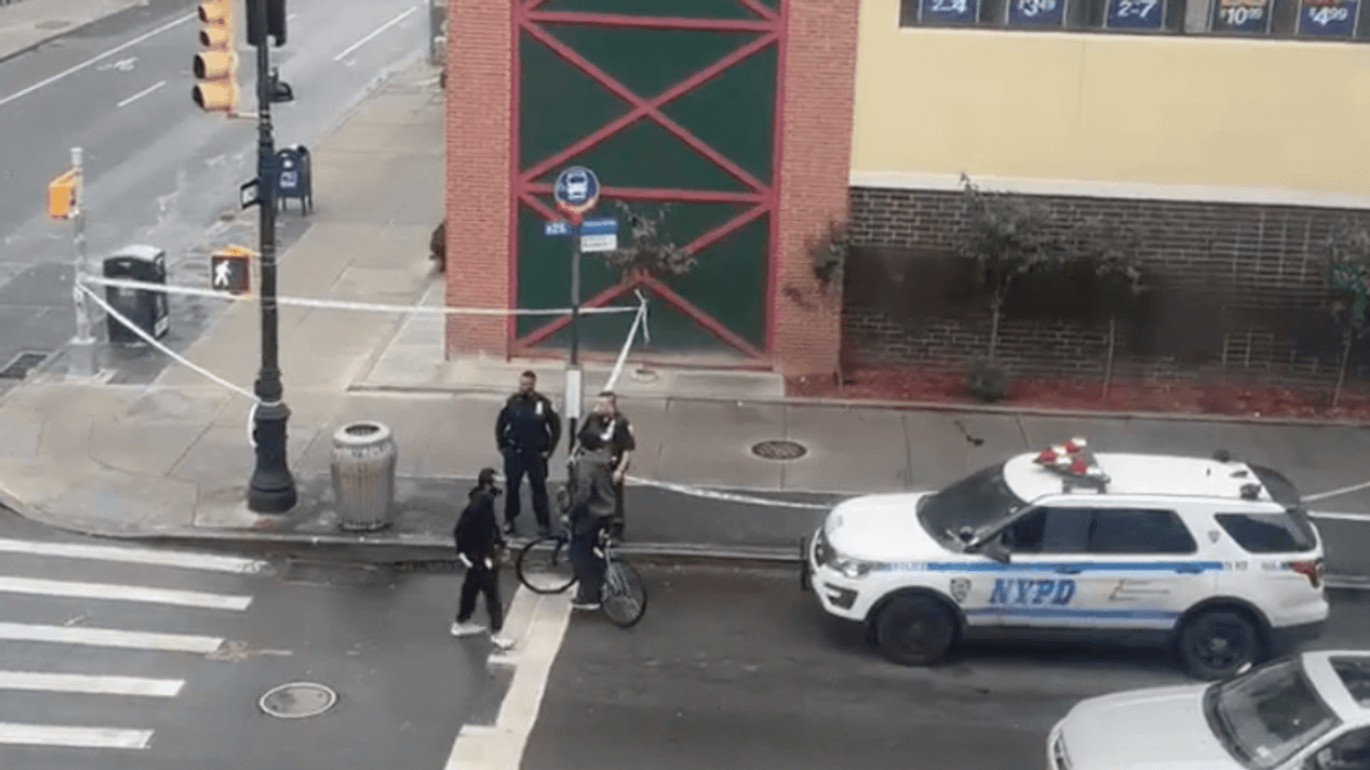 A 70-year-old woman was shot on a Brooklyn street corner Monday afternoon, police said.