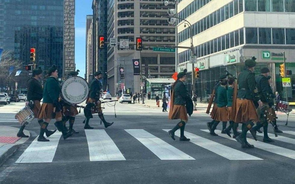 A band marching along John F. Kennedy Boulevard during the St. Patrick