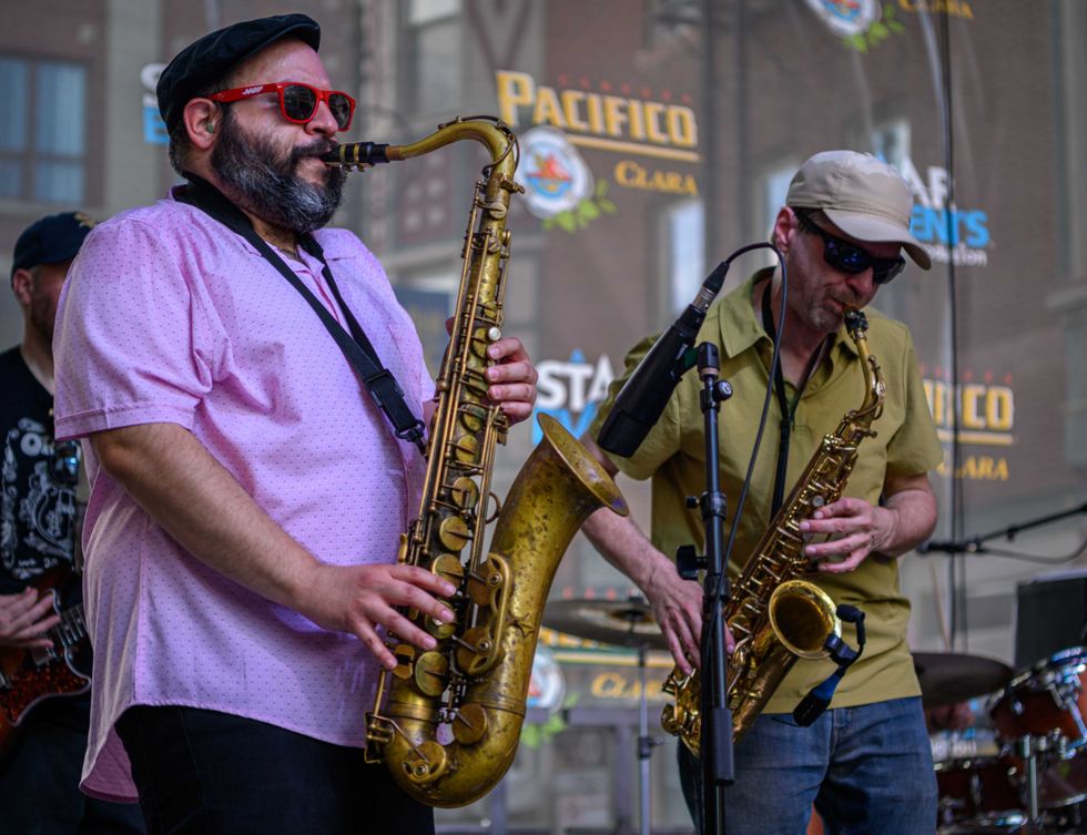 A band performs at a previous Mayfest