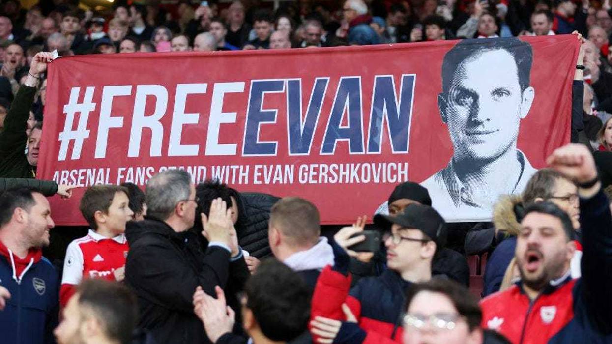 A banner is displayed in support of WSJ reporter jailed in Russia, Evan Gershkovich prior to the Premier League match between Arsenal FC and Southampton FC at Emirates Stadium on April 21, 2023 in London, England.