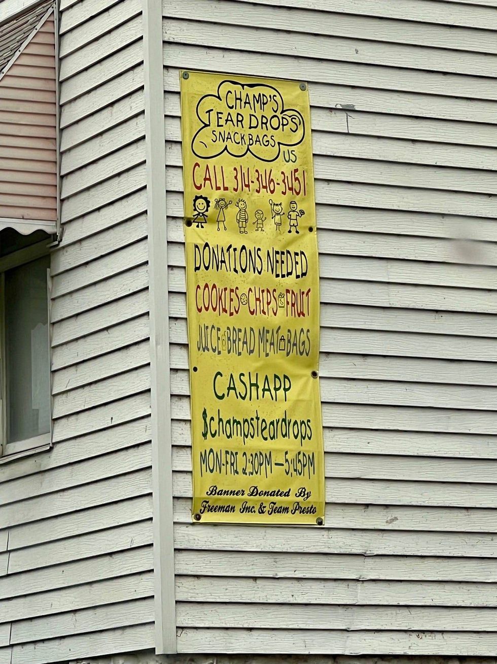 A banner on the side of her home helps families in need, and donors find Champ