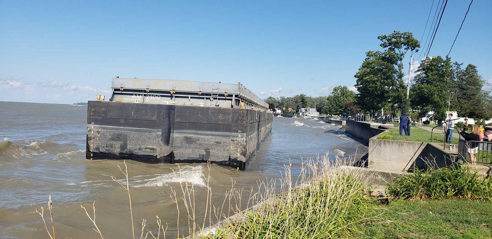 A barge being towed from Erie to Buffalo came loose overnight and is now beached at Van Buren Point near Dunkirk. The Coast Guard says the owner hopes to have it out tomorrow.