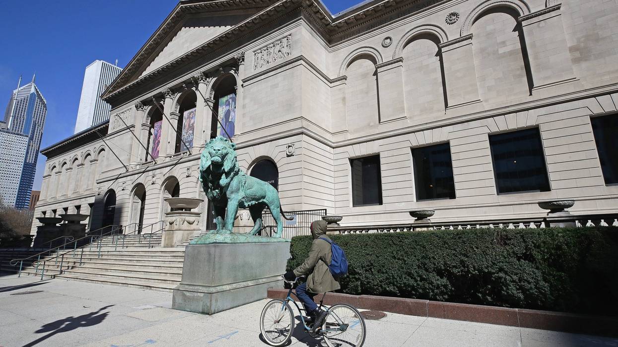 A bicyclist rides past the shuttered Art Institute of Chicago during the "shelter in place" order that was continued until April 30 for the COVID-19 crisis in downtown on April 01, 2020 in Chicago, Illinois.