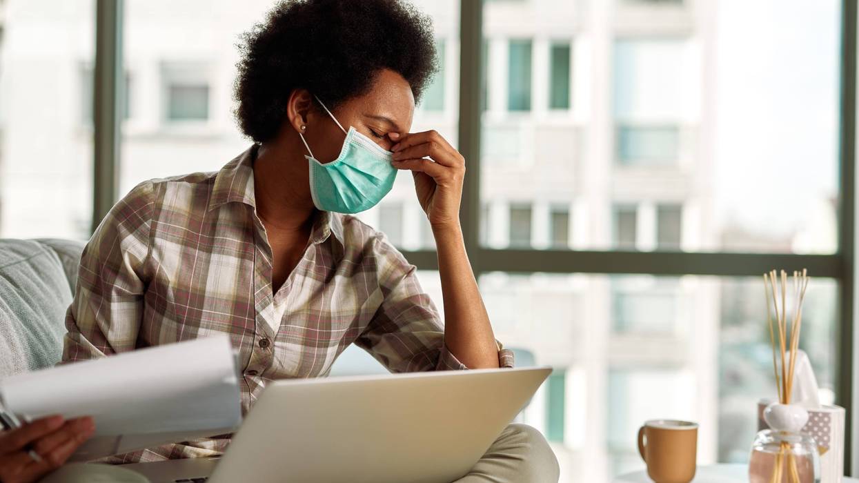 A Black woman working from home during pandemic.