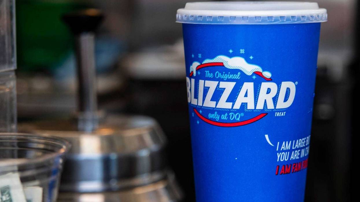 A Blizzard sits in a cup with a lid at a Dairy Queen