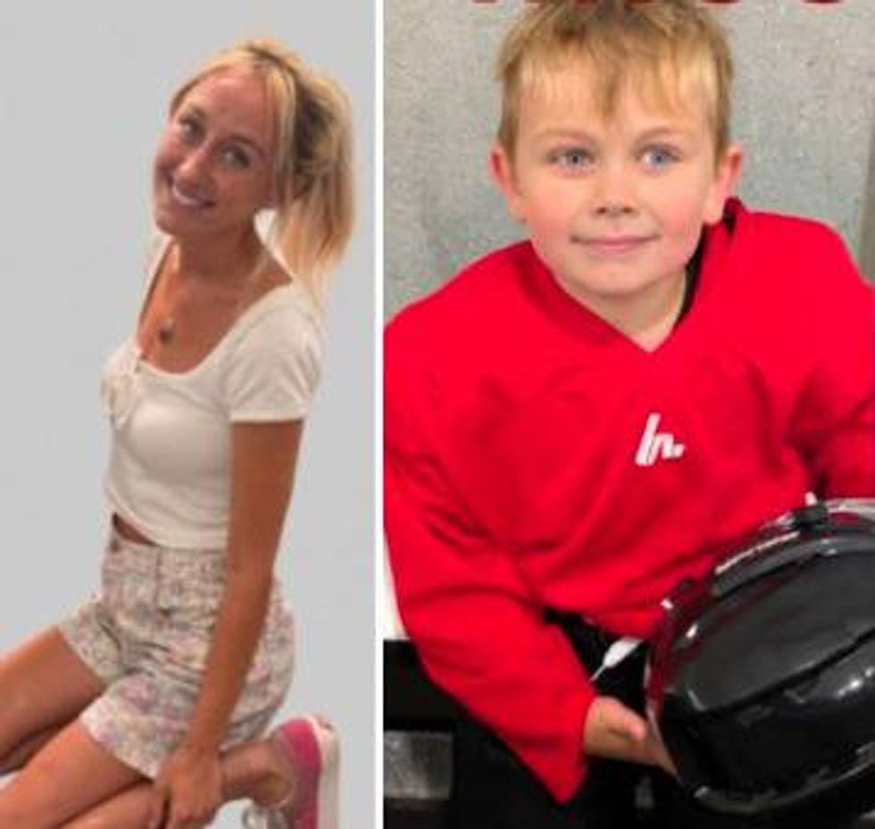 A blonde woman smiling in a white top next to a blonde boy in a red hockey jersey holding a helmet.