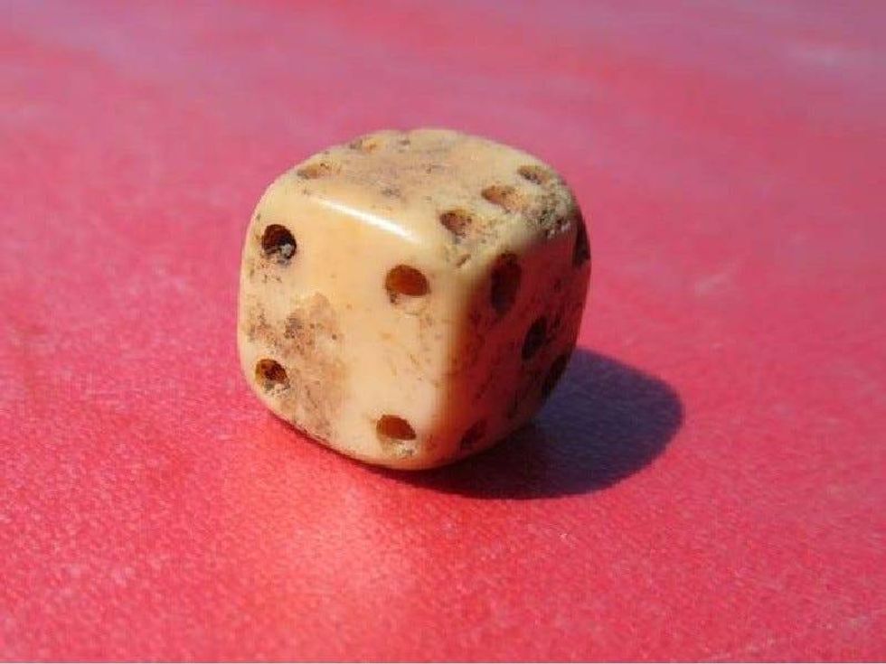 A bone or ivory gaming die found at Colonial Michilimackinac