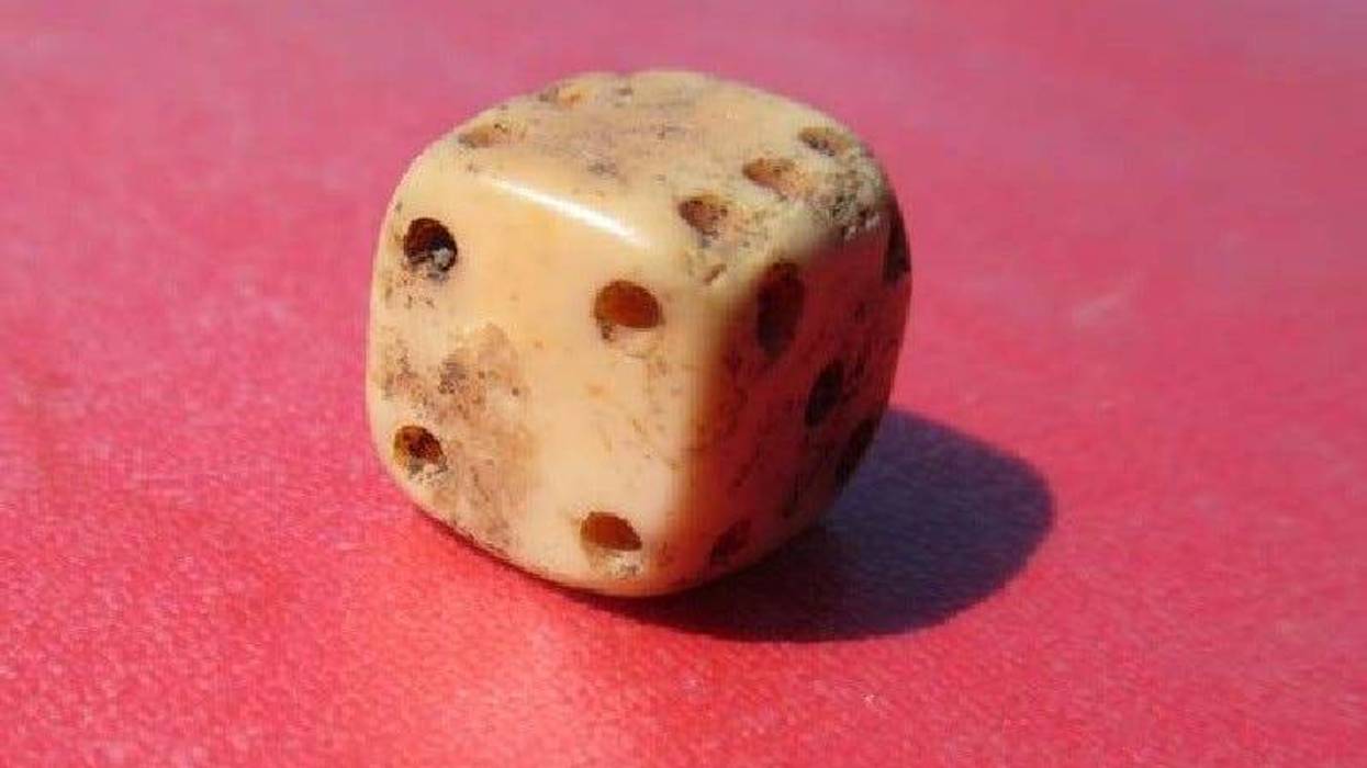 A bone or ivory gaming die found at Colonial Michilimackinac