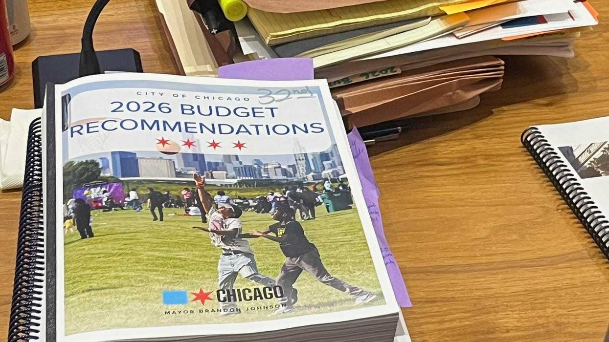 A bound copy of Mayor Johnson's budget recommendations on an alderman's desk.