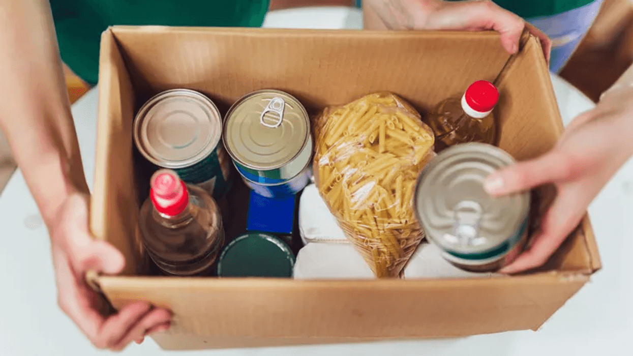 A box of food created by volunteers at a food pantry.
