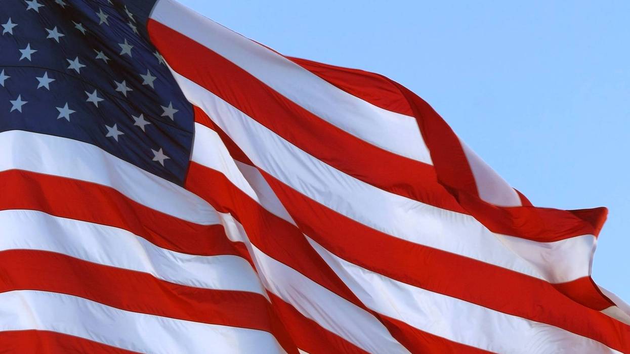 A brand new 30-by-60-foot American flag waved in the wind once again outside an Ottawa County car dealership to usher in the holiday weekend after thieves cut down the original flag five days ago.