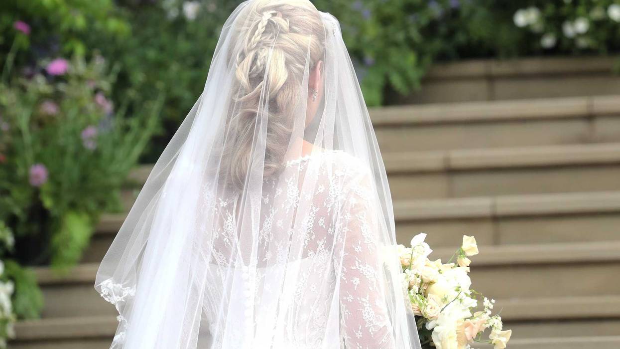 A bride walks down the aisle at an undated wedding.