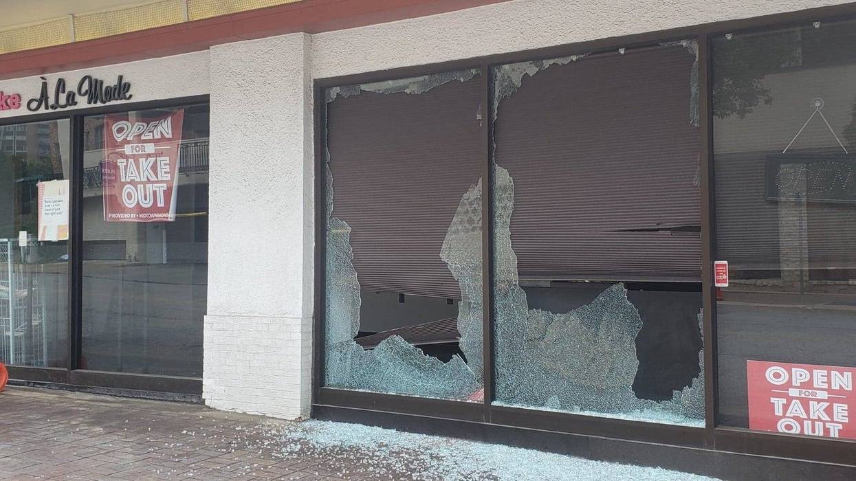 A broken shop window on the country club plaza the day after being smashed during a demonstration