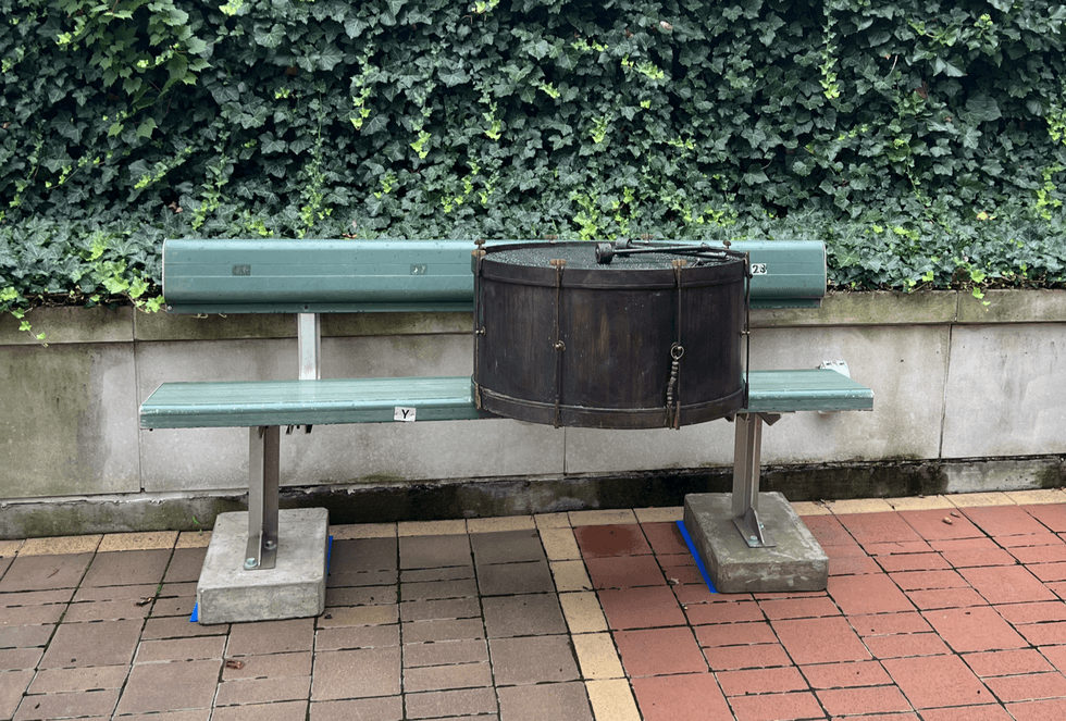 A bronze drum sits on a bleacher seats in Heritage Park at Progressive Field - a tribute to lifelong fan and drummer John Adams. Adams passed away Monday at the age of 71.