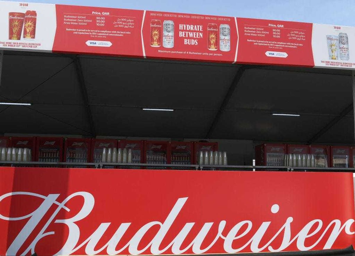 A Budweiser sign is displayed at a bar at the Fan Festival ahead of the FIFA World Cup Qatar 2022 at Fan Festival Al Bidda Park on November 18, 2022 in Doha, Qatar.
