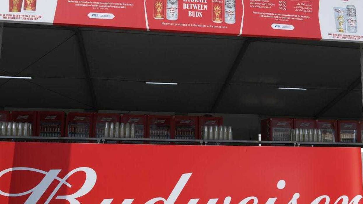 A Budweiser sign is displayed at a bar at the Fan Festival ahead of the FIFA World Cup Qatar 2022 at Fan Festival Al Bidda Park on November 18, 2022 in Doha, Qatar.