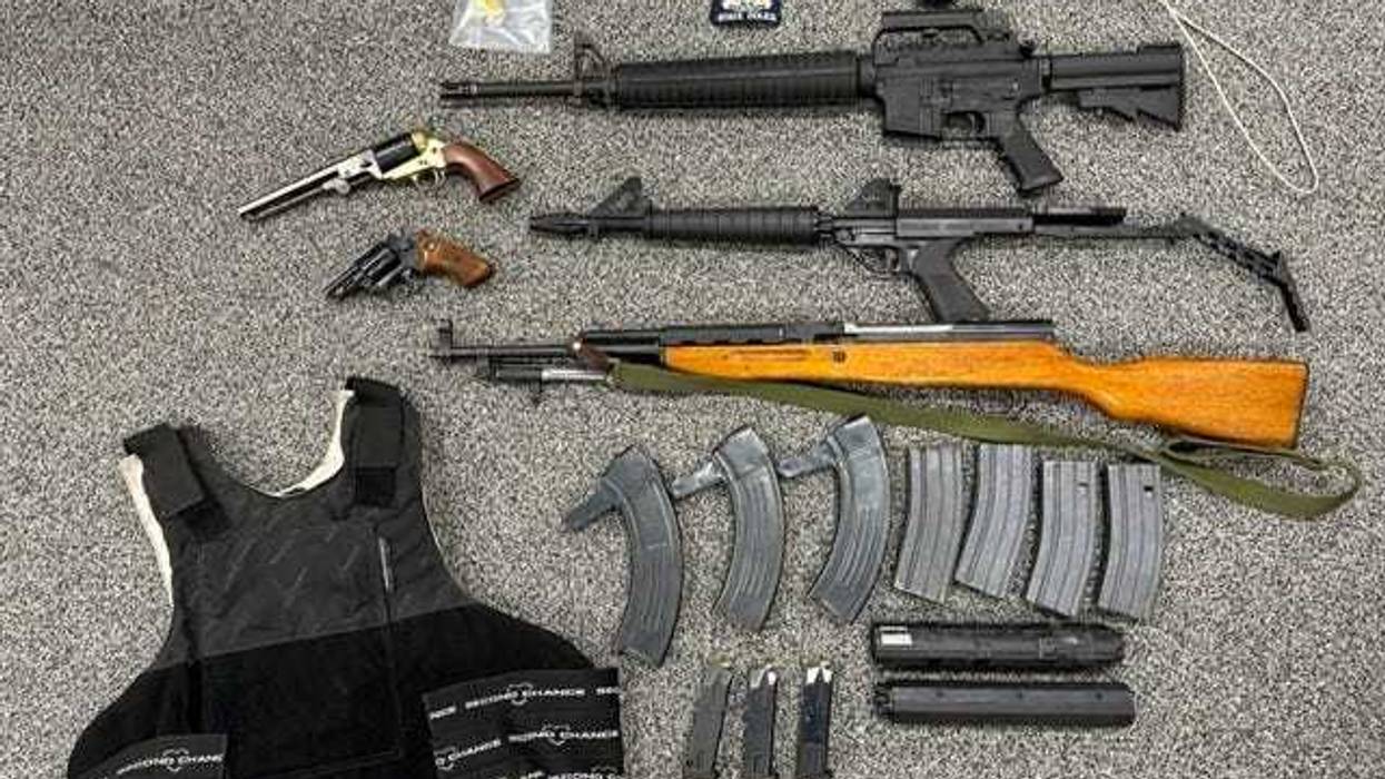 A Buffalo man has been arrested with possession of several weapons after a warrant execution for child pornography.