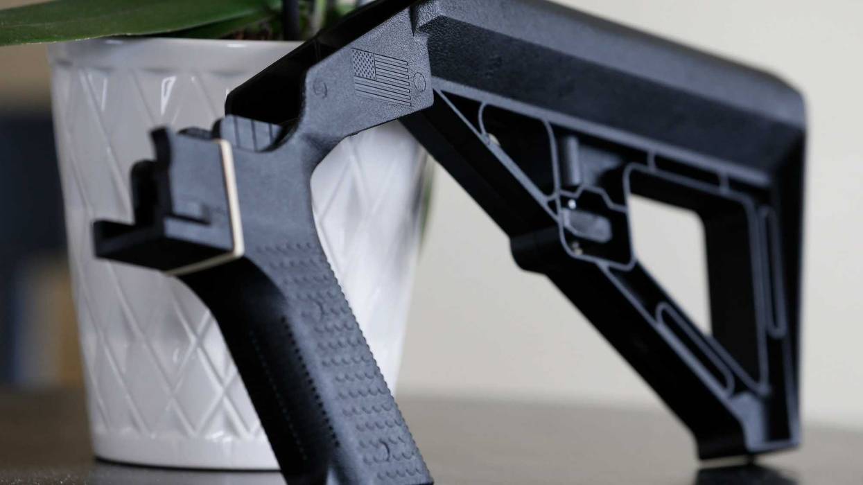 A bump stock is displayed in Harrisonburg, Va., on March 15, 2019. The Supreme Court has struck down a Trump-era ban on bump stocks, a gun accessory that allows semi-automatic weapons to fire rapidly like machine guns.