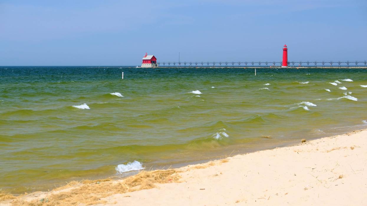 A bunch of drunk beach goers spoiled holiday fun for many as authorities were forced to clear parts of a popular West Michigan beach and close its famous pier.