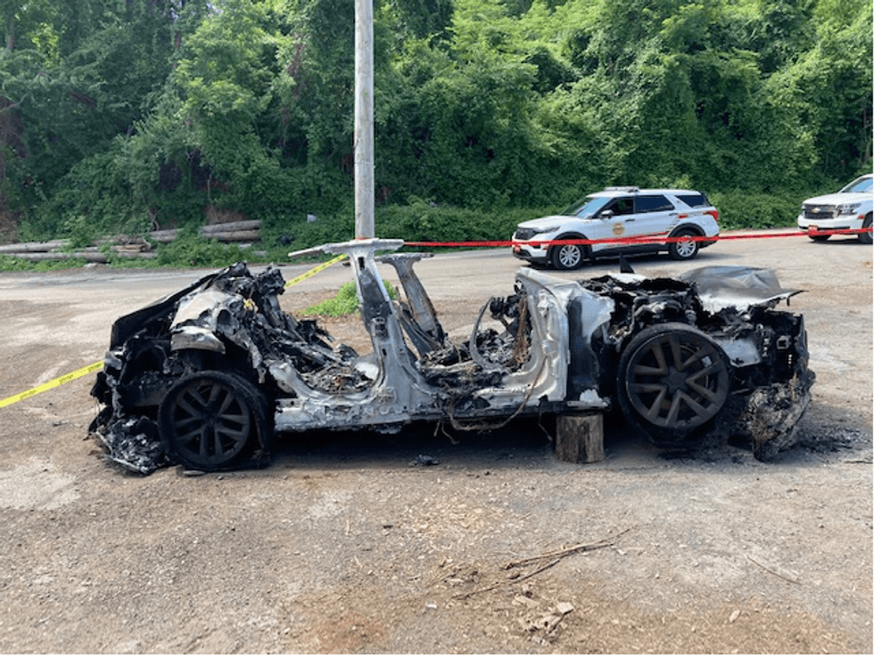 A burned-out Tesla after it caught fire Tuesday in Gladwyne.