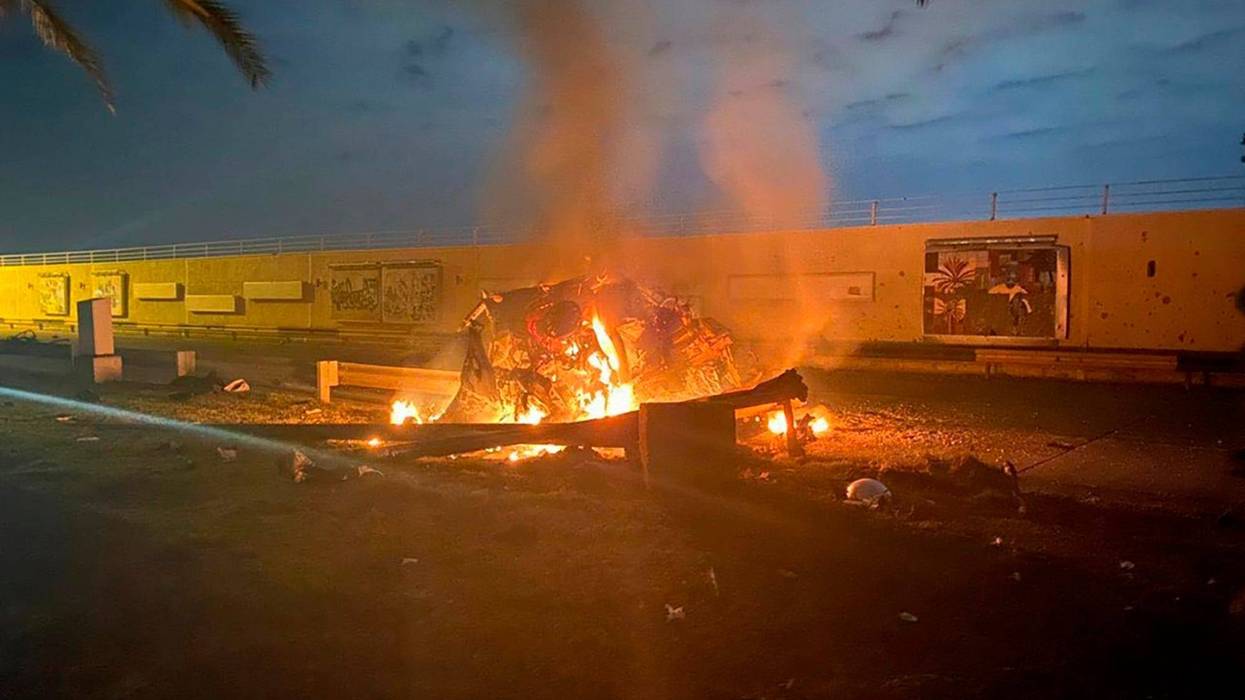 A burning vehicle is shown at Baghdad International Airport following an airstrike, in Baghdad, Iraq, early Friday, Jan. 3, 2020.