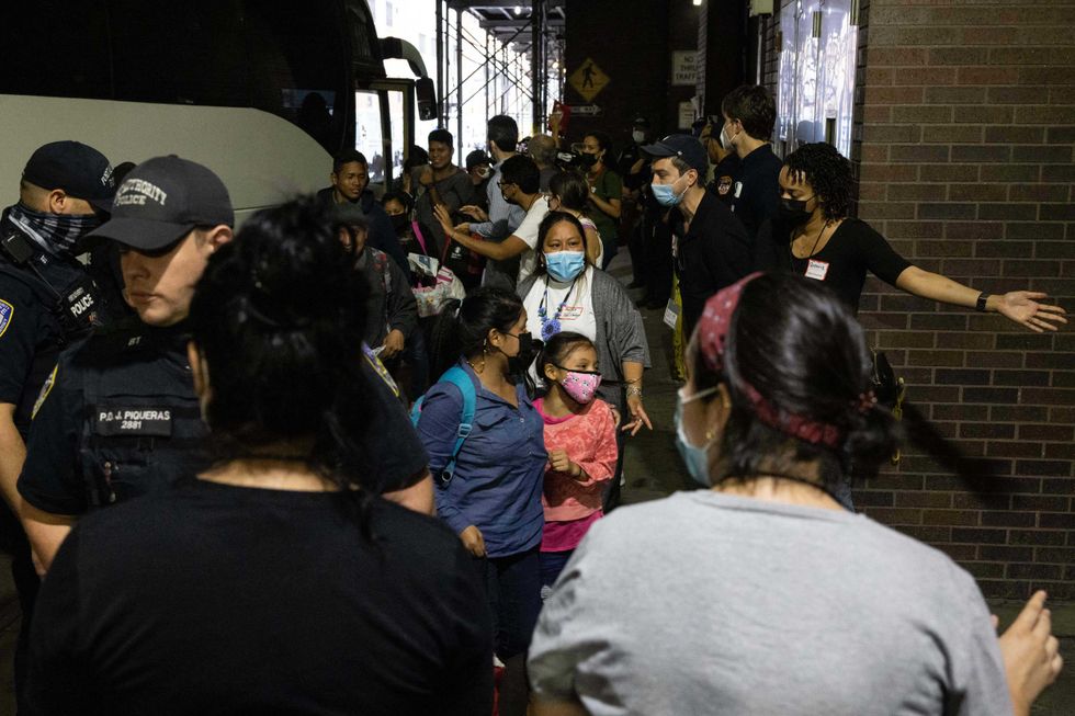 A bus carrying migrants from Texas arrives at Port Authority Bus Terminal on Aug. 10, 2022 in New York