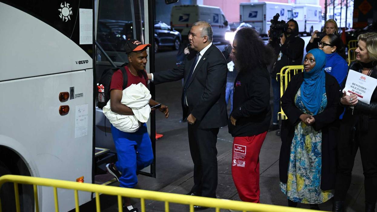 A bus carrying the migrants from Texas arrives at the Port Authority bus terminal in Manhattan on May 3, 2023.