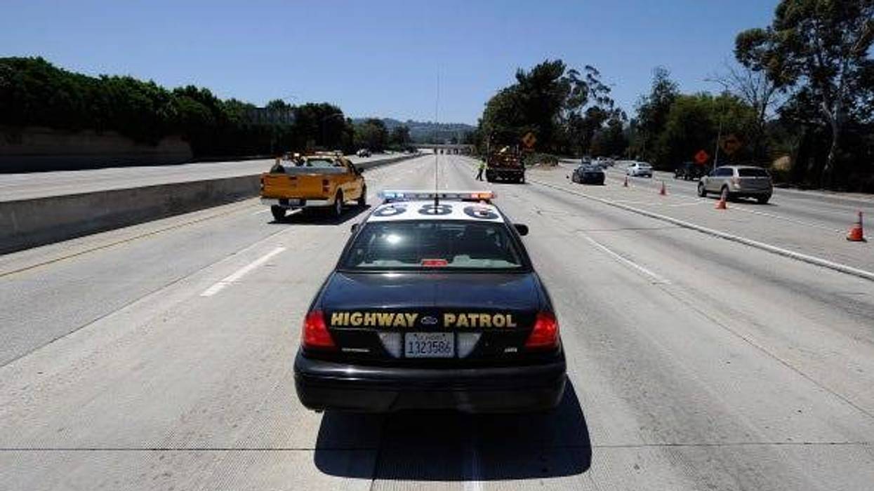 A California Highway Patrol cruiser waits to lead motorists