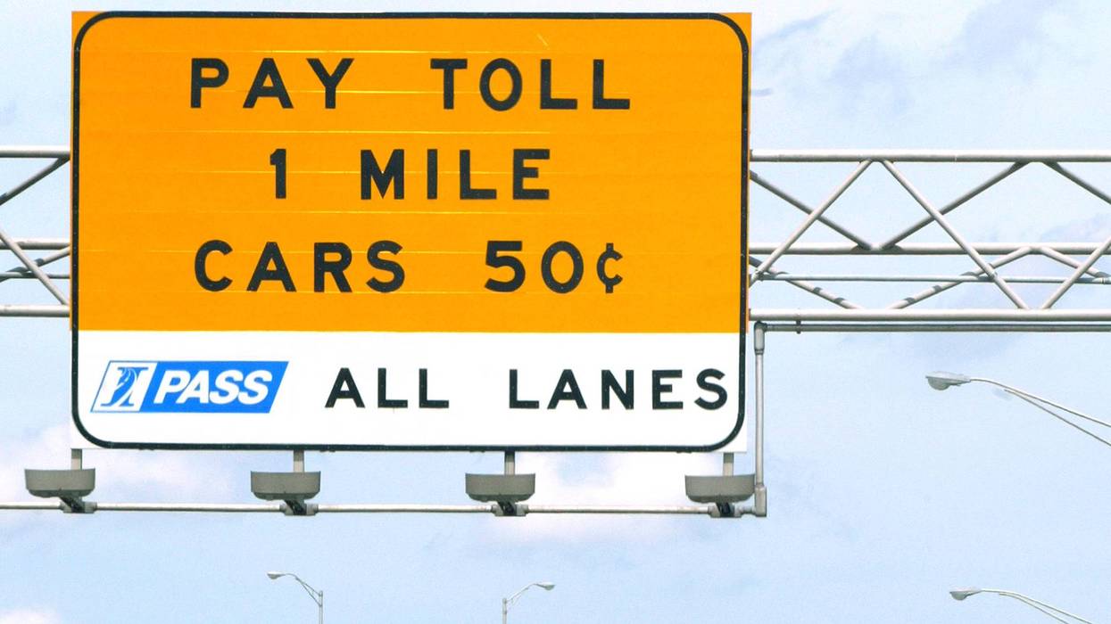 A car approaches a toll gate on the Illinois Tollway.