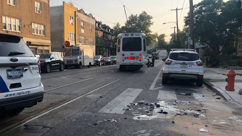A car collided with a trolley Sunday morning, knocking it off its tracks at the intersection of 52nd Street and Chester Avenue for several hours.