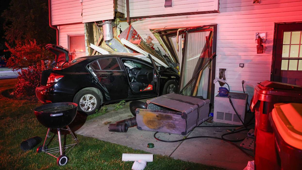 Woodstock man charged after crashing car into townhome