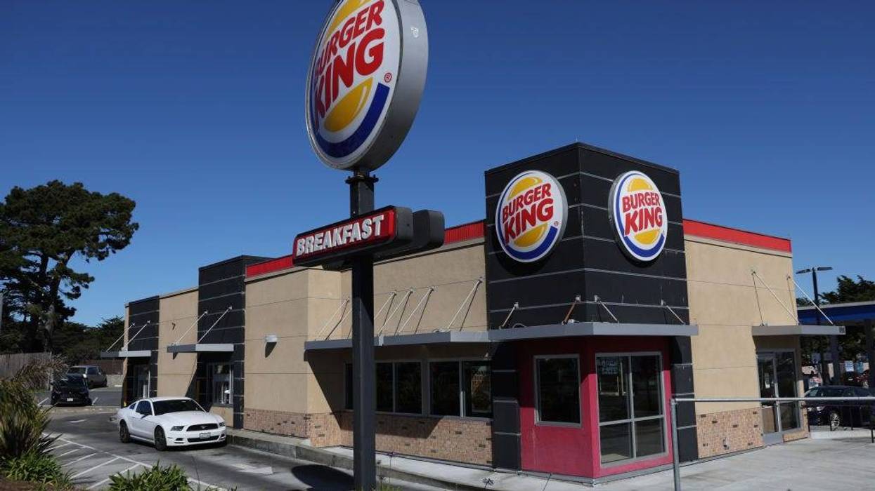 A car goes through the drive-thru a a Burger King restaurant on February 15, 2022 in Daly City, California. Restaurant Brands International, the parent company of Burger King, reported strong fourth quarter earnings that beat analyst expectations with revenue of $1.55 billion.