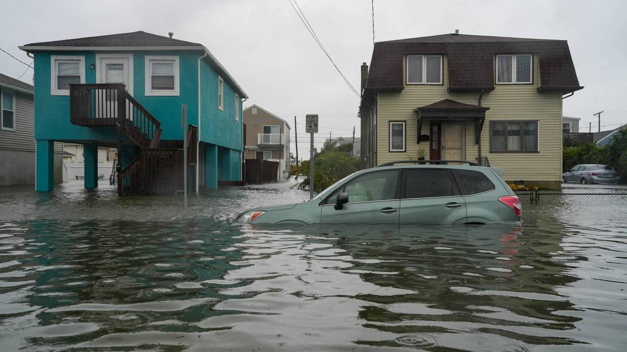 A car is seen submerged in water on a flooded road during a nor'easter storm on Sept. 26, 2026, in Point Pleasant, New Jersey.