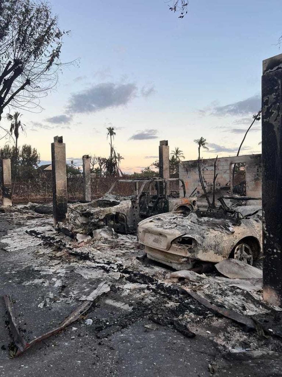 A car marked with an orange "X" indicating a body was not inside.